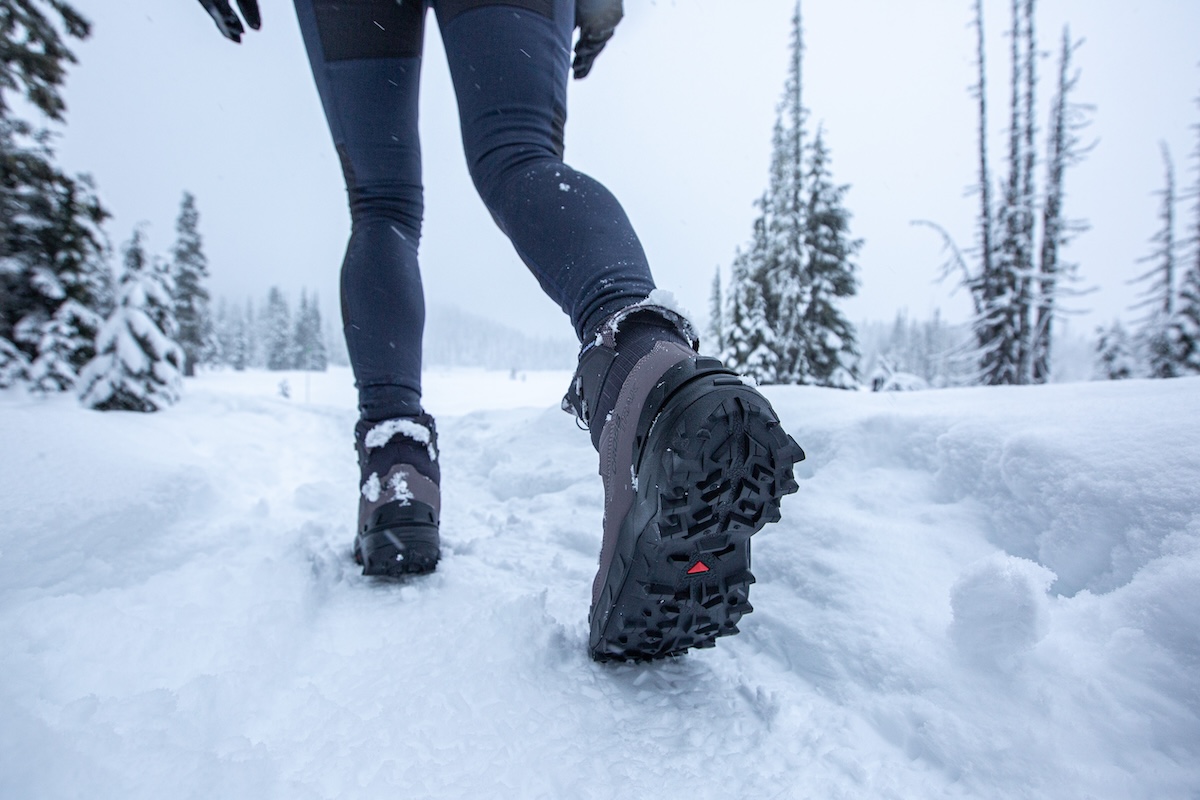 A close up of the tread on a winter hiking boot