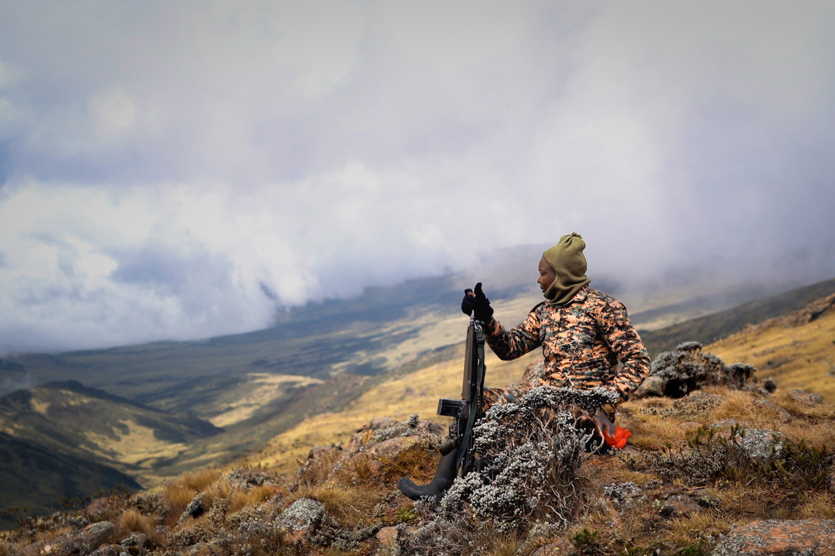 A KWS ranger on the summit of Mt. Satima