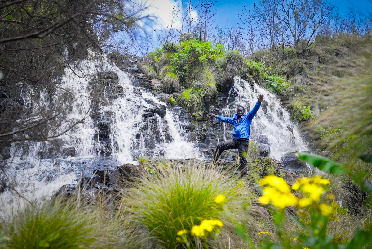 Paul poses in front of a small waterfall we came across