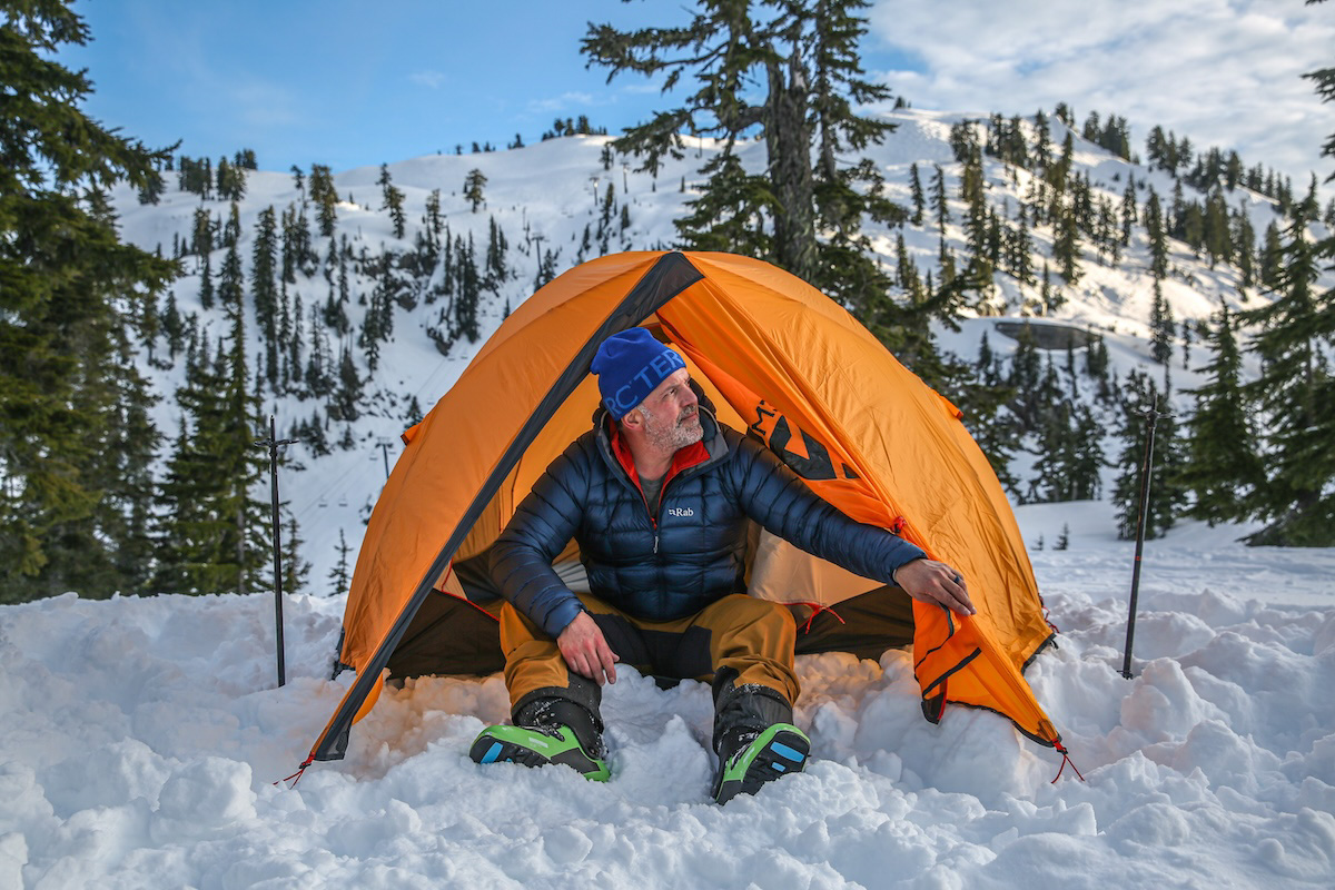 Emerging from a tent with the Rab Mythic Alpine Jacket
