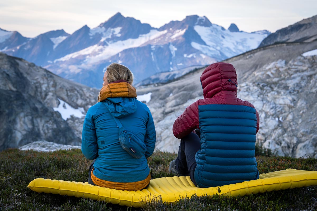 Wearing down jackets while taking in the mountain views