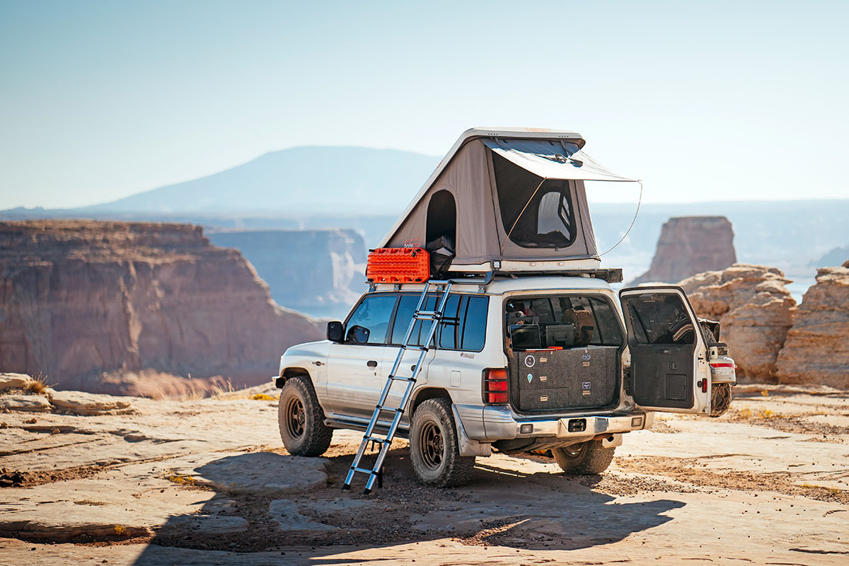 The Roofnest Sparrow Eye rooftop tent on a car at a viewpoint