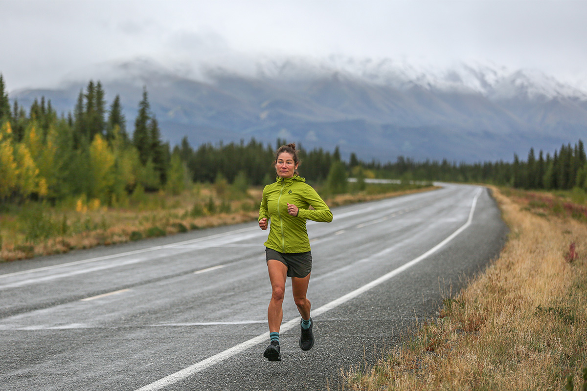 A woman running on a road in moody weather