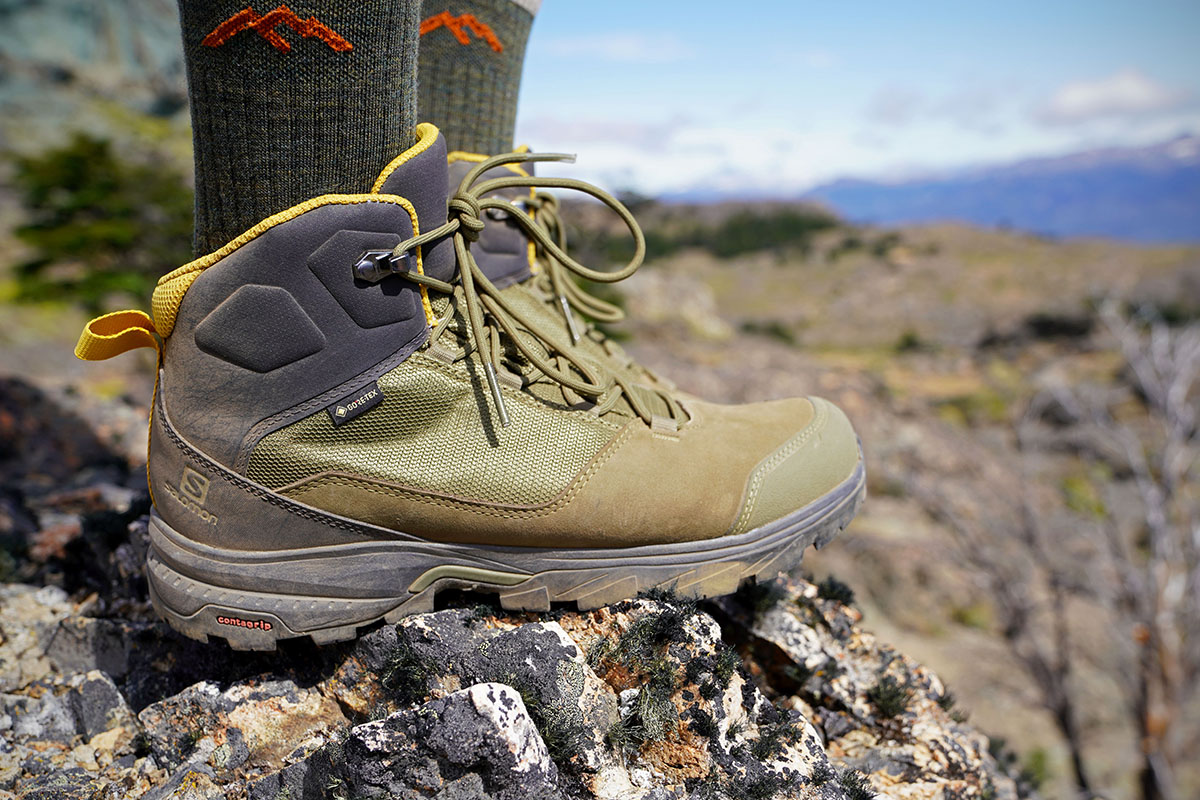 Salomon OUTward Mid GTX hiking boot (standing on rock)