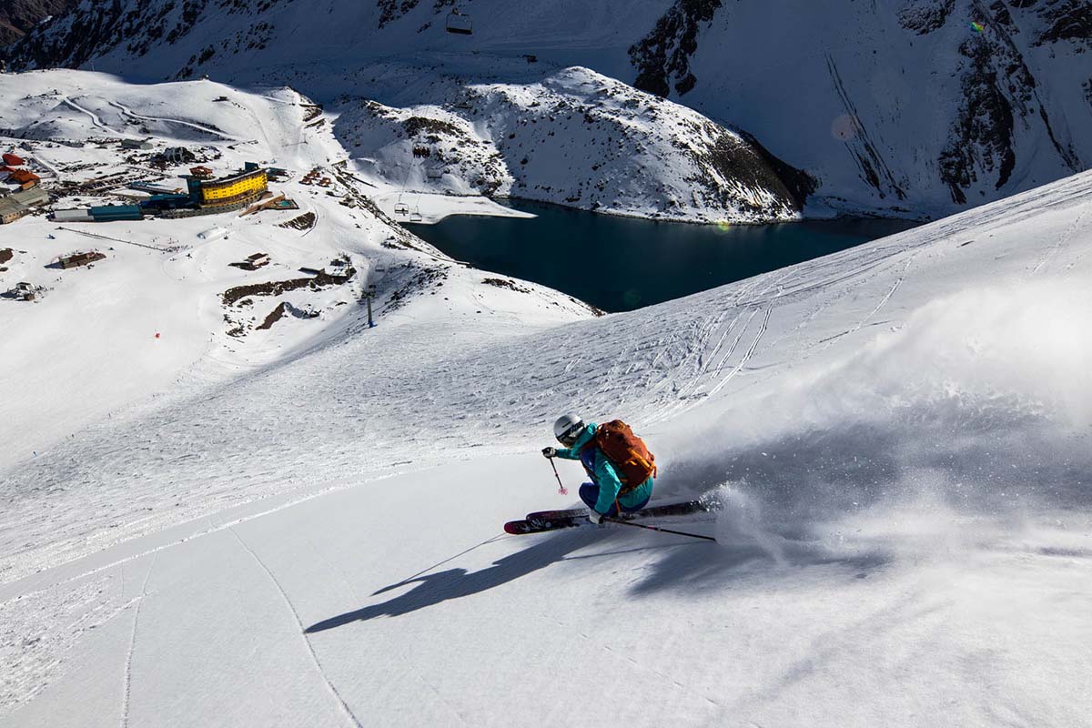 A skiier makes turns on a sunny day in Portillo, Chile.