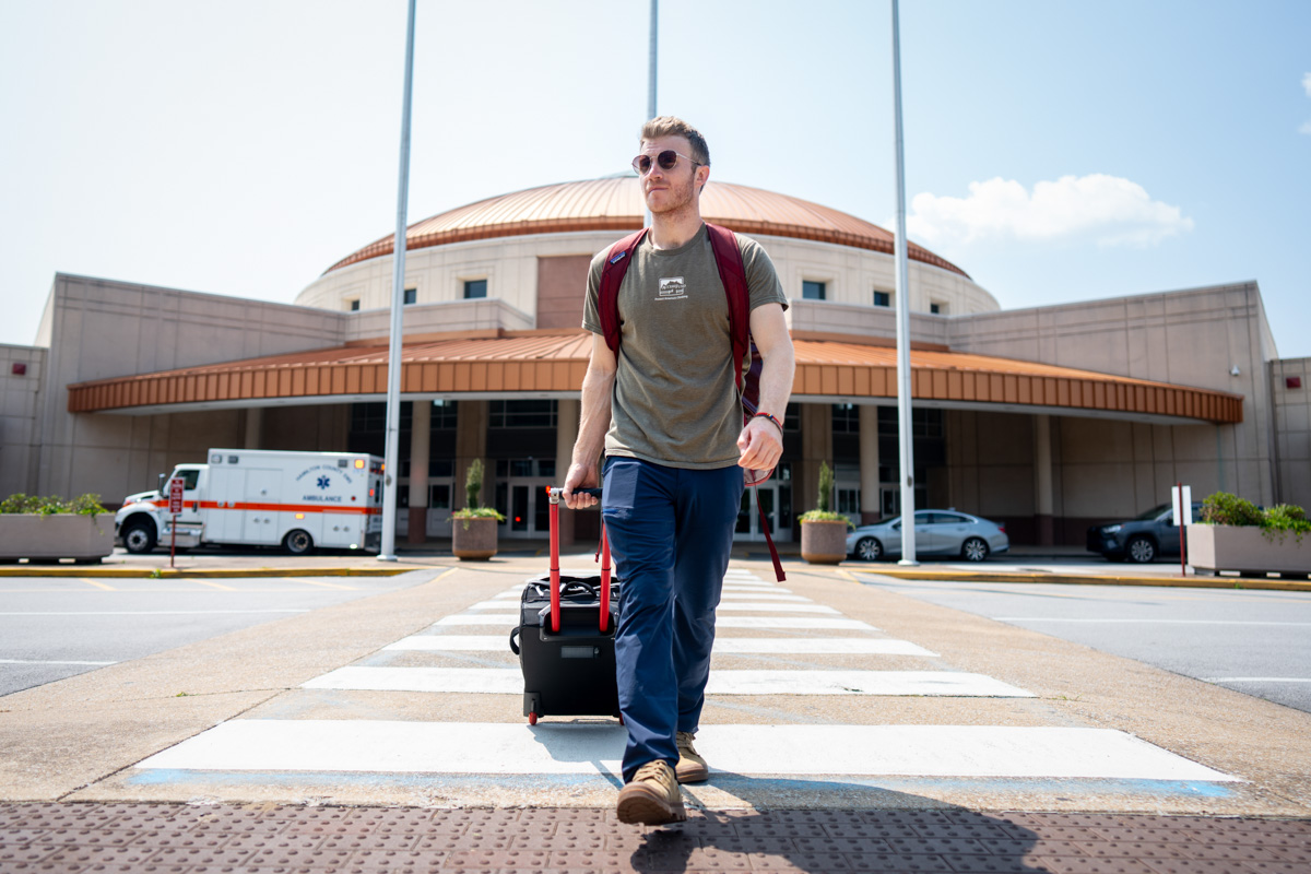 Our editor Chris walks with a wheeled duffel bag while coming out of Chattanooga Airport