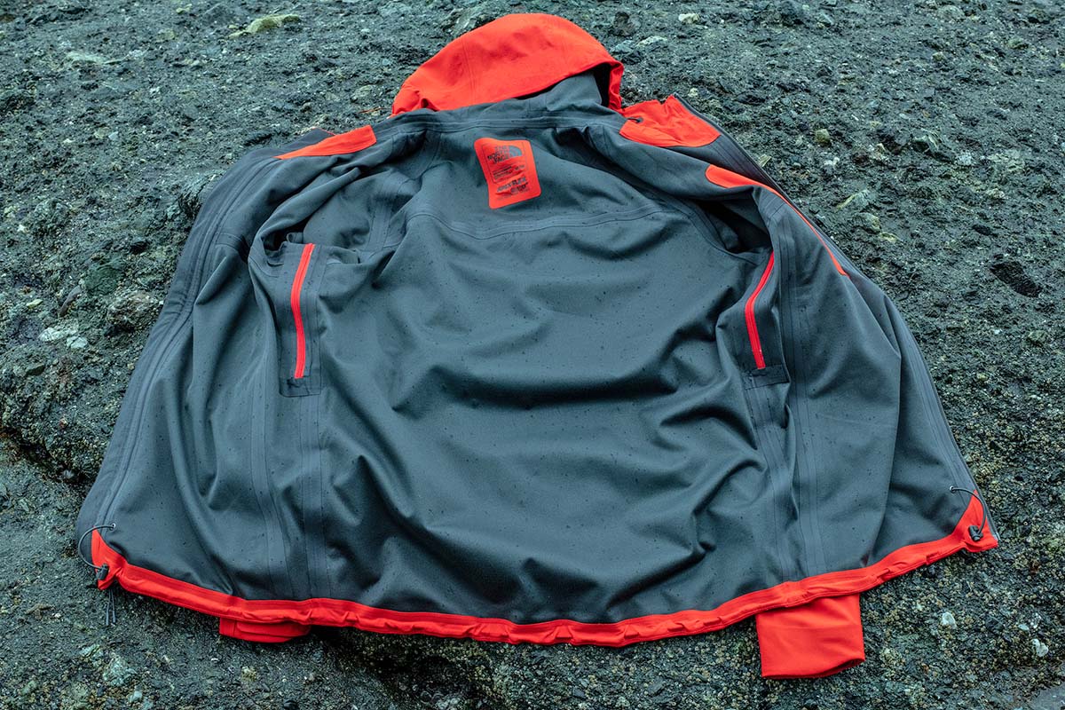 the inside of a softshell jacket laid on the rocks